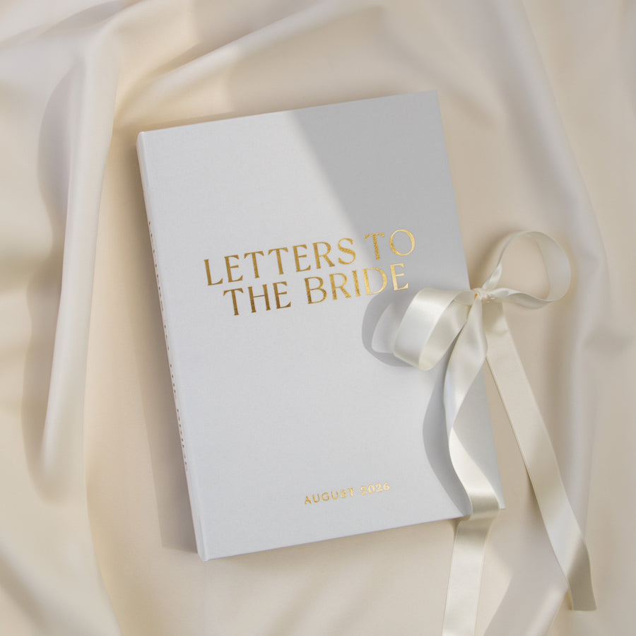 Personalized Letters to the Bride book with silky white linen cover and real gold foil lettering.
