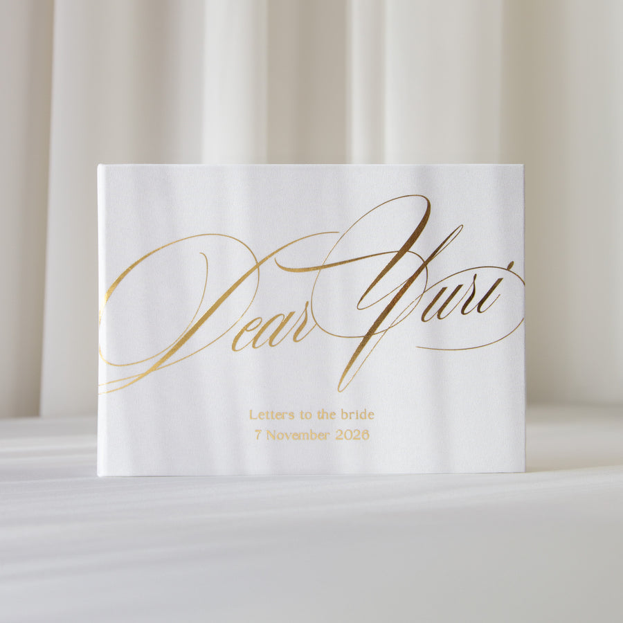 Personalized Dear Yuri bridal keepsake book in Silky White with elegant Real Gold script and wedding date.